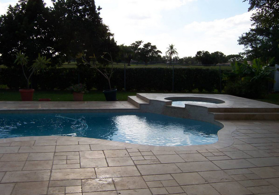 Inspiration for a transitional backyard tile and rectangular natural hot tub remodel in Miami