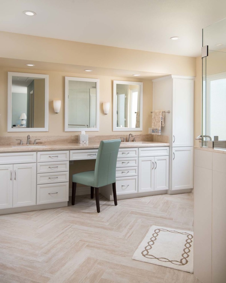 Design ideas for a large transitional master bathroom in San Diego with an undermount sink, raised-panel cabinets, white cabinets, granite benchtops, a corner shower, a two-piece toilet, beige tile, porcelain tile, beige walls and porcelain floors.