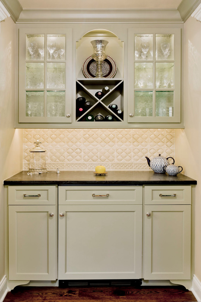 Photo of a traditional kitchen in Chicago with shaker cabinets, green cabinets and white splashback.