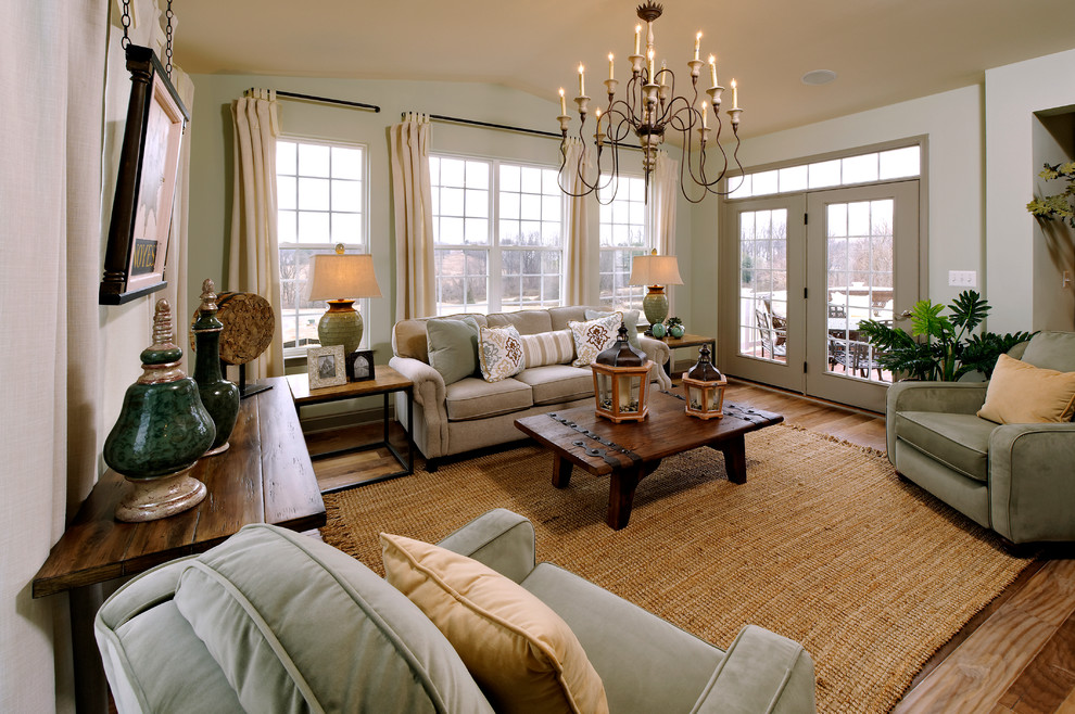 Photo of a traditional family room in Atlanta with grey walls and medium hardwood floors.