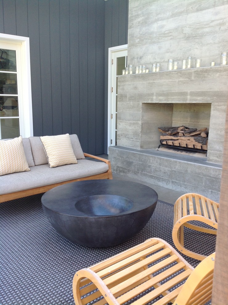 Photo of a large industrial backyard patio in San Francisco with an outdoor kitchen, concrete slab and no cover.
