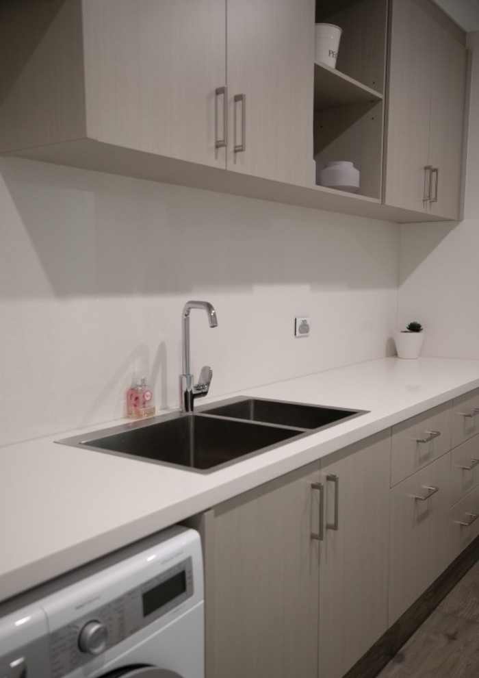 This is an example of a transitional laundry room in Perth.