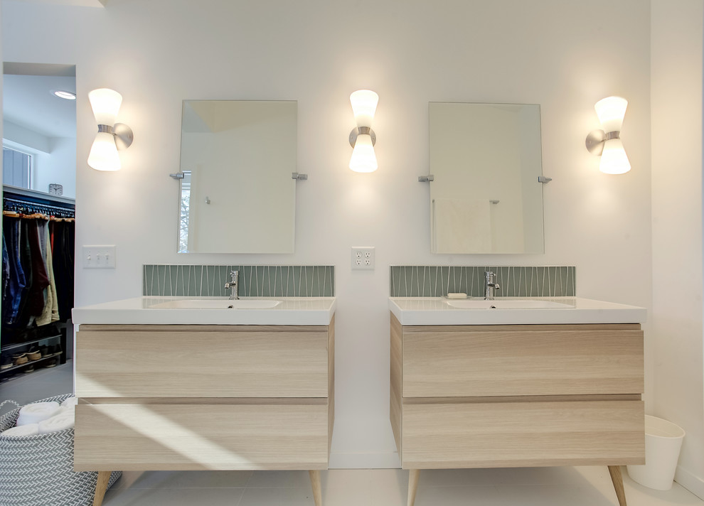 Photo of a mid-sized midcentury master bathroom in Grand Rapids with flat-panel cabinets, light wood cabinets, a curbless shower, green tile, glass tile, ceramic floors, an integrated sink, white floor, a hinged shower door, white walls and quartzite benchtops.