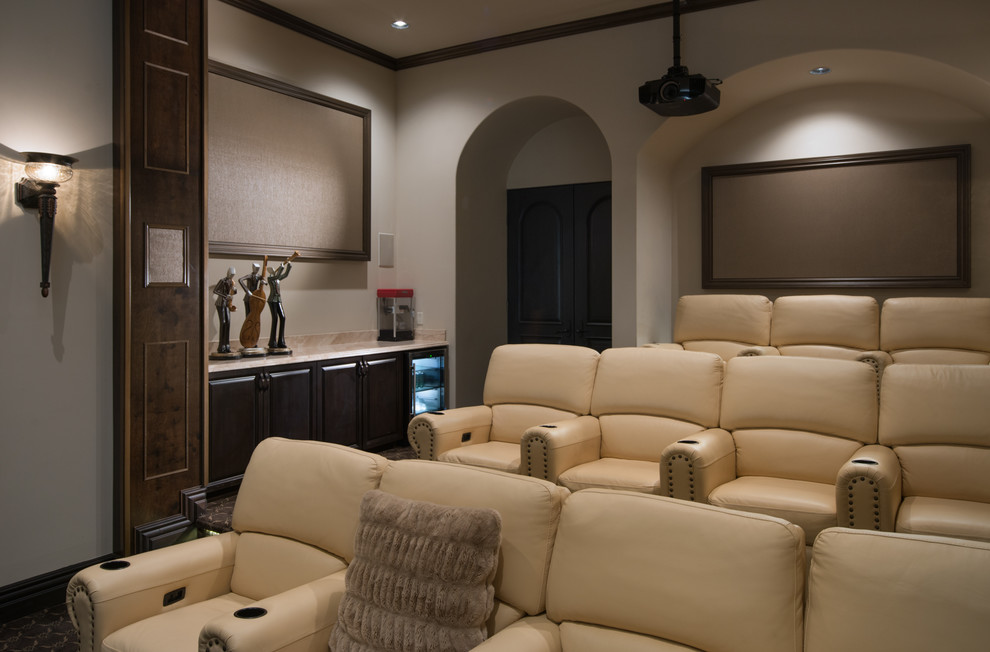 Photo of an expansive mediterranean open concept home theatre in Phoenix with white walls, porcelain floors, a wall-mounted tv and white floor.
