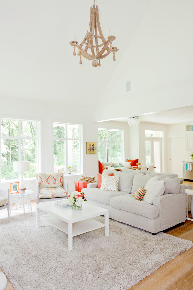 This is an example of a transitional family room in Vancouver with white walls.