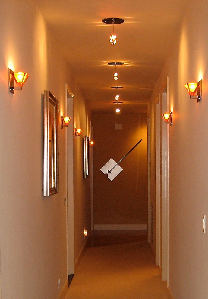 Design ideas for an expansive contemporary hallway in San Luis Obispo with beige walls, carpet and beige floor.