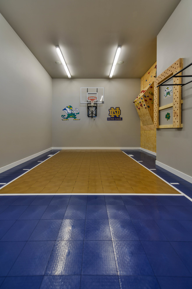 Inspiration for a large country indoor sport court in Minneapolis with grey walls.