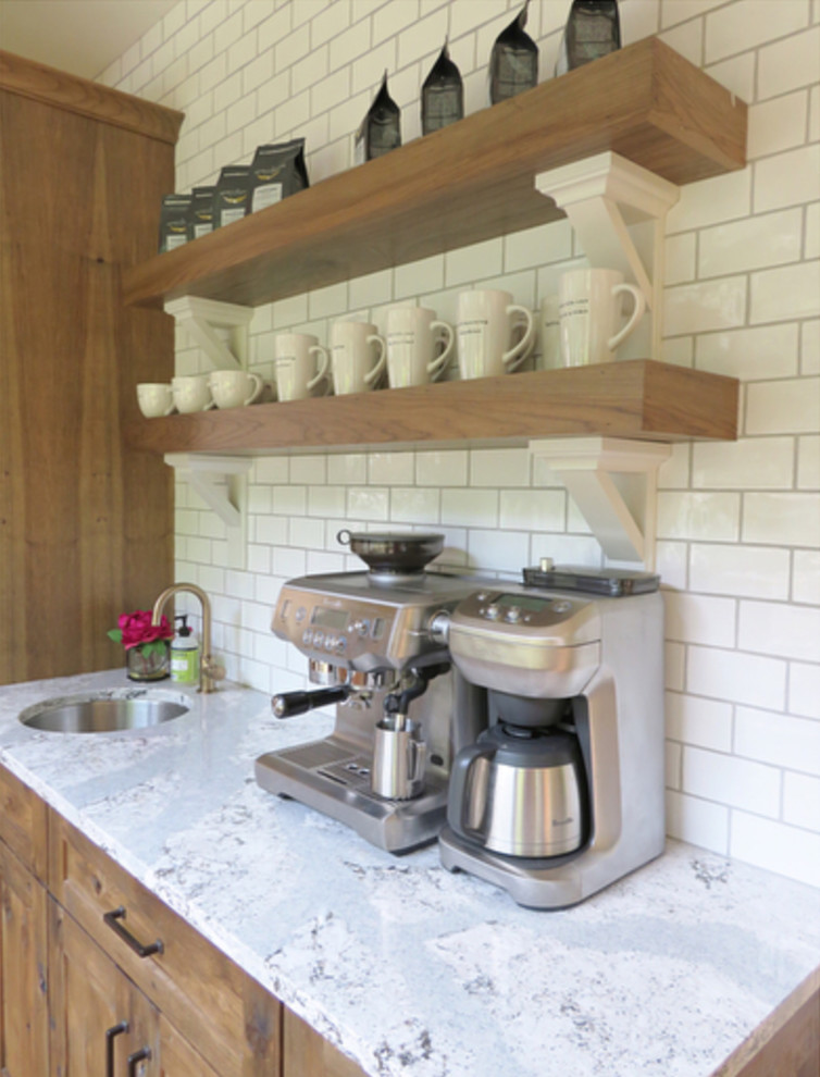 Example of a transitional kitchen design with beaded inset cabinets and medium tone wood cabinets