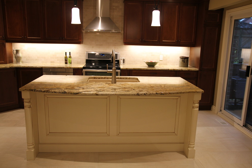 Example of a transitional kitchen design in Toronto