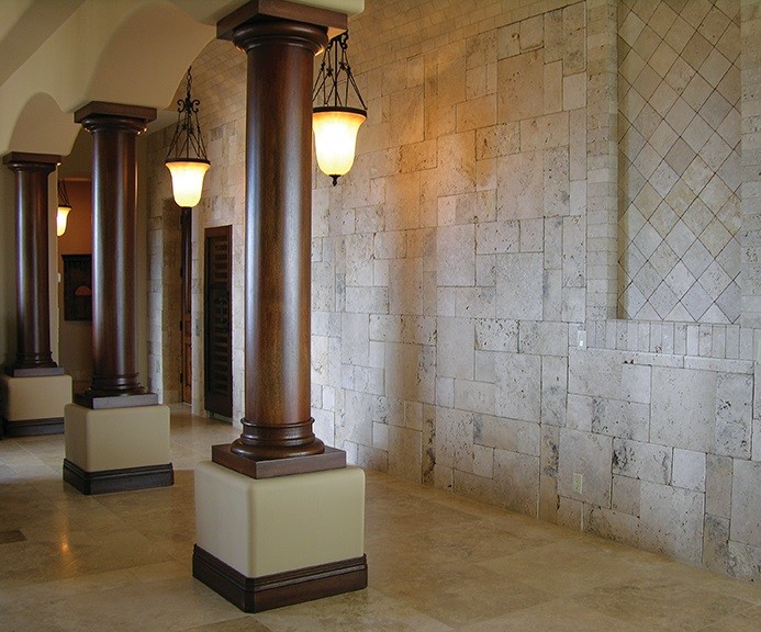 Mid-sized midcentury hallway in Phoenix with beige walls and travertine floors.