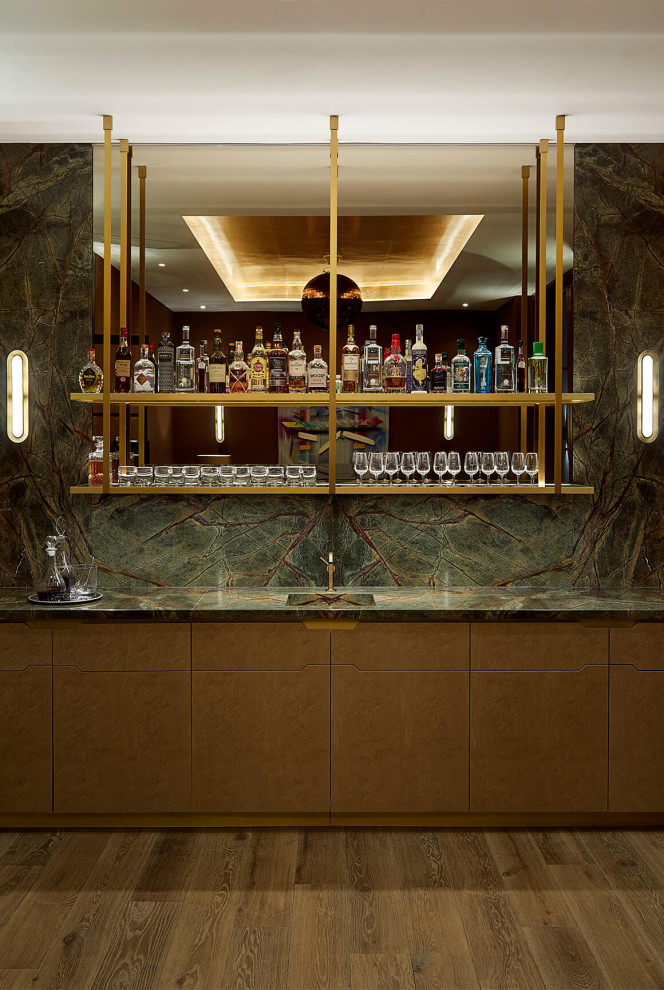 Design ideas for a contemporary home bar in London with a feature wall.