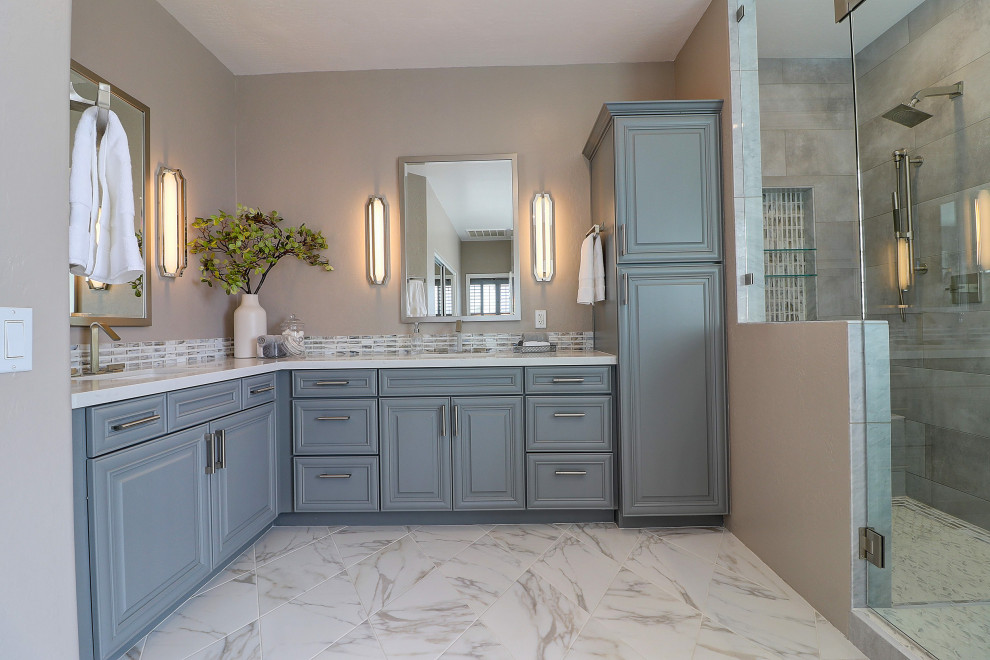 Mid-sized transitional master bathroom in Phoenix with raised-panel cabinets, grey cabinets, a freestanding tub, a double shower, a two-piece toilet, beige tile, porcelain tile, beige walls, porcelain floors, an undermount sink, engineered quartz benchtops, white floor, a hinged shower door, white benchtops, a shower seat, a double vanity and a built-in vanity.