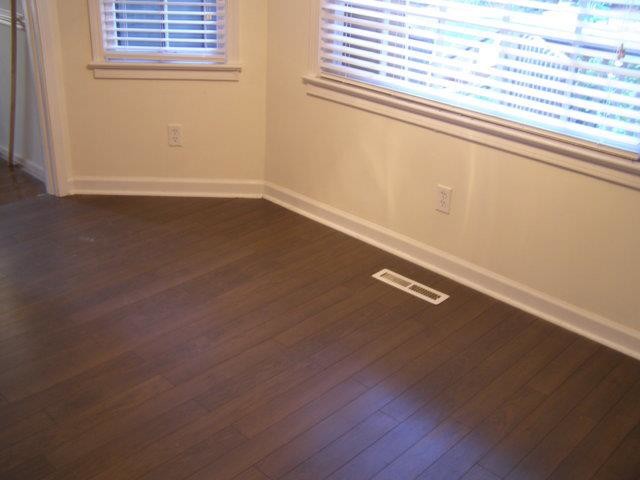 Dining room - small dark wood floor dining room idea with beige walls