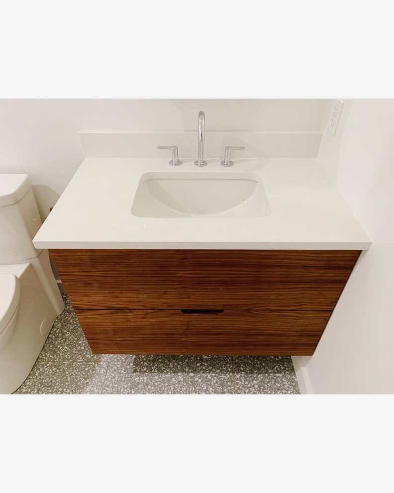 Small contemporary bathroom in Philadelphia with flat-panel cabinets, dark wood cabinets, an alcove tub, an alcove shower, a two-piece toilet, white tile, ceramic tile, white walls, terrazzo floors, a drop-in sink, engineered quartz benchtops, grey floor, a hinged shower door and white benchtops.