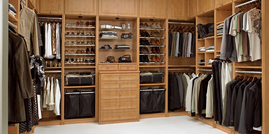 Elegant gender-neutral closet photo in Other with recessed-panel cabinets