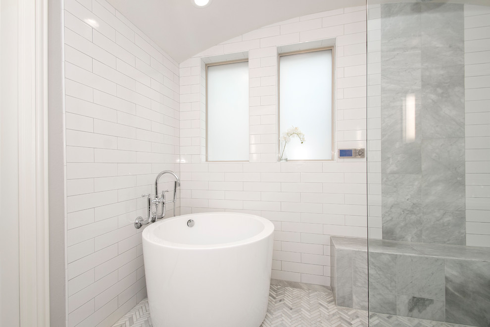 This is an example of a mid-sized transitional master bathroom in Dallas with raised-panel cabinets, grey cabinets, a japanese tub, an open shower, a two-piece toilet, beige tile, ceramic tile, beige walls, marble floors, an undermount sink, engineered quartz benchtops, grey floor, an open shower and white benchtops.