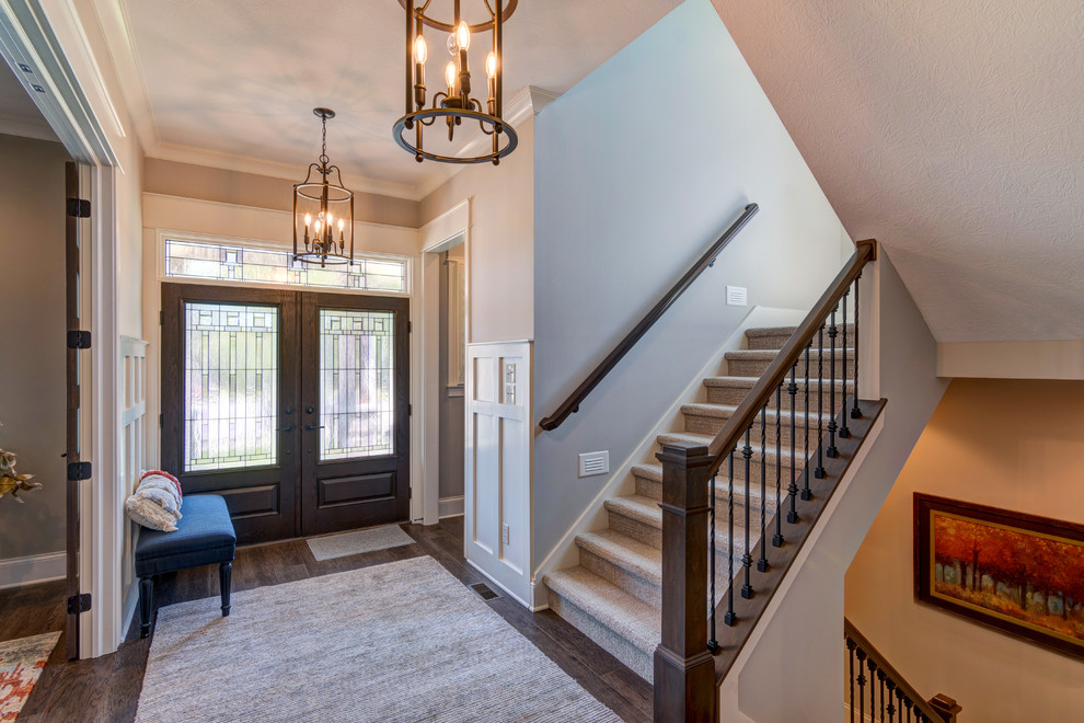 Inspiration for a mid-sized country foyer in Indianapolis with beige walls, vinyl floors, a double front door, a brown front door and brown floor.