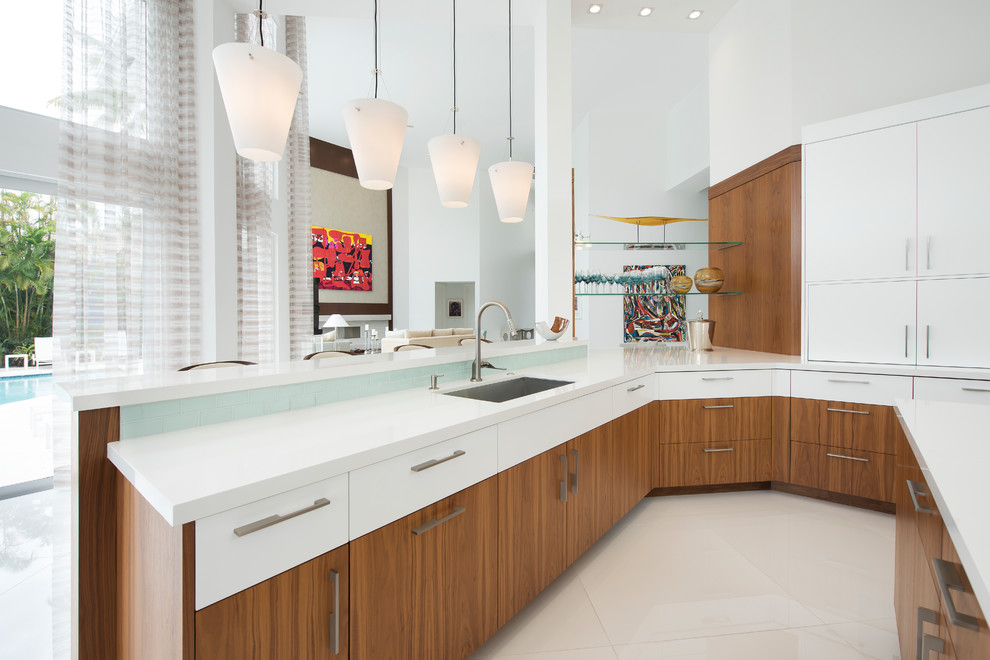 Example of a large kitchen design with an undermount sink, blue backsplash and porcelain backsplash