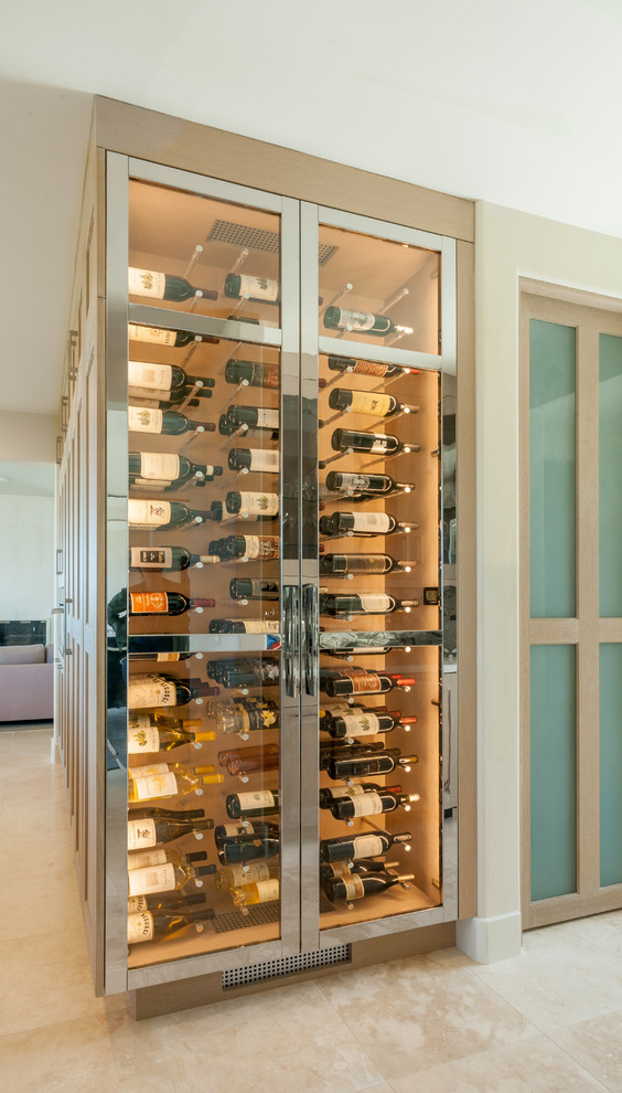This is an example of a small transitional wine cellar in San Francisco with ceramic floors, beige floor and display racks.