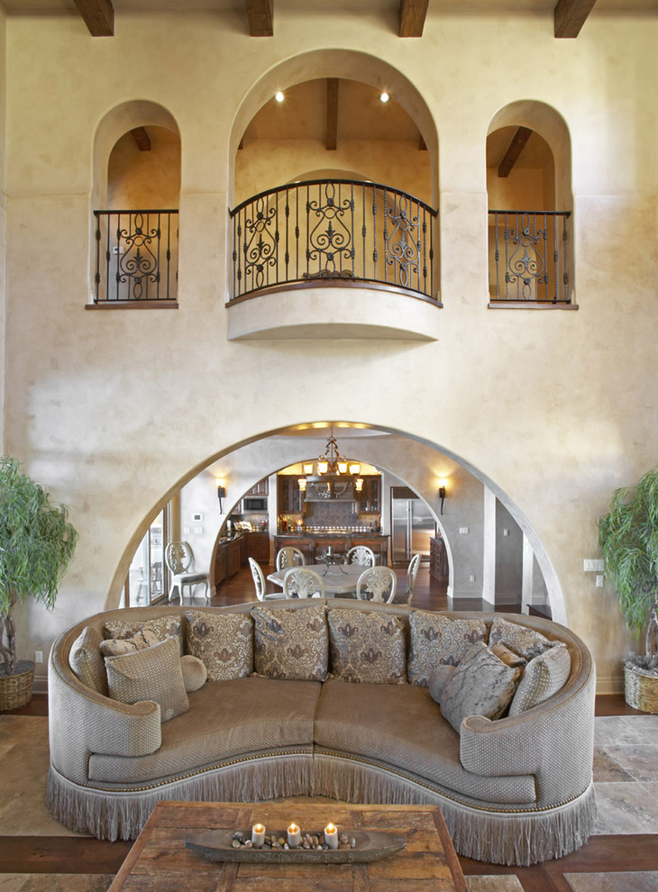 Inspiration for a mediterranean living room in Austin with beige walls.