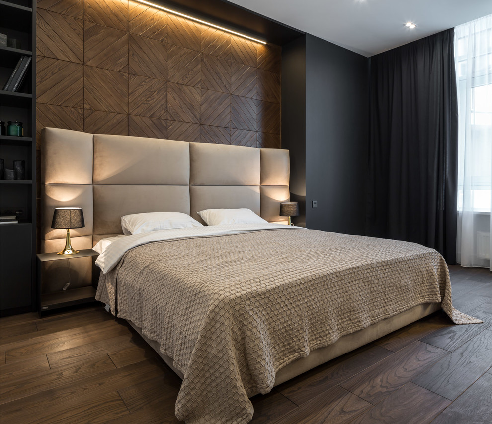 This is an example of a mid-sized contemporary master bedroom in Other with multi-coloured walls, medium hardwood floors, no fireplace and brown floor.