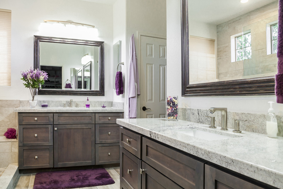 Mid-sized transitional master bathroom in Phoenix with recessed-panel cabinets, dark wood cabinets, an alcove shower, a one-piece toilet, beige tile, orange walls, porcelain floors, an undermount sink, granite benchtops, brown floor, an open shower and porcelain tile.