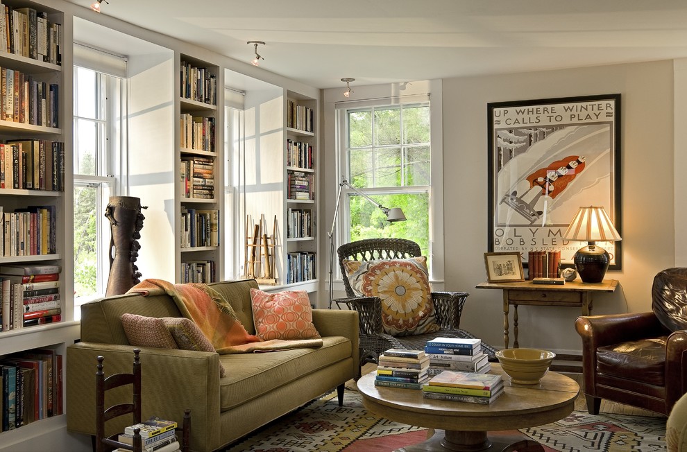 Traditional enclosed living room in Burlington with a library and beige walls.