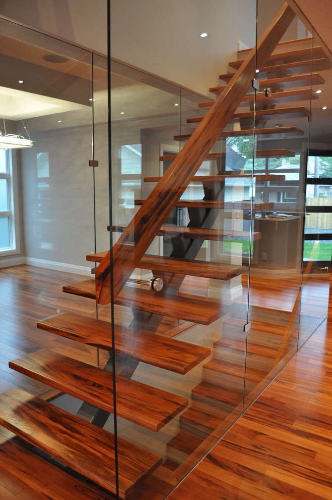 Inspiration for a mid-sized contemporary wood straight staircase in Edmonton with open risers.