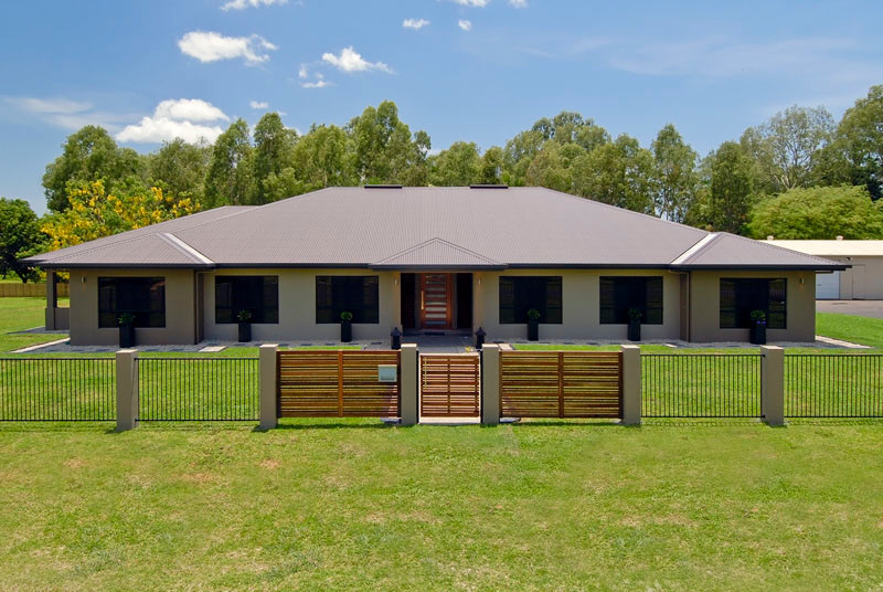 Expansive contemporary one-storey brown exterior in Cairns.