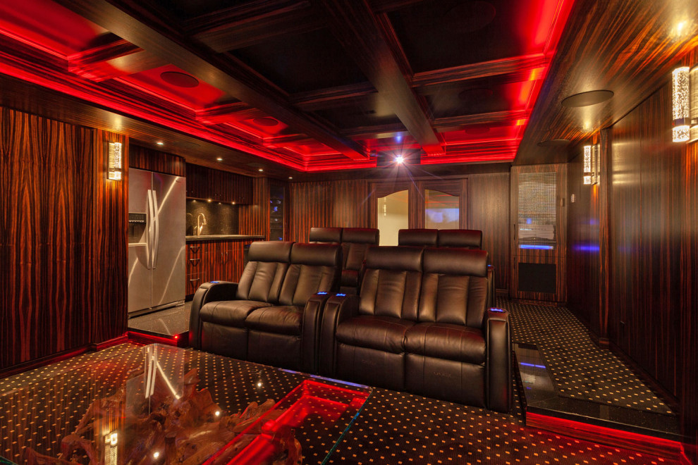 Large enclosed home theatre in Calgary with brown walls, carpet, a projector screen and black floor.