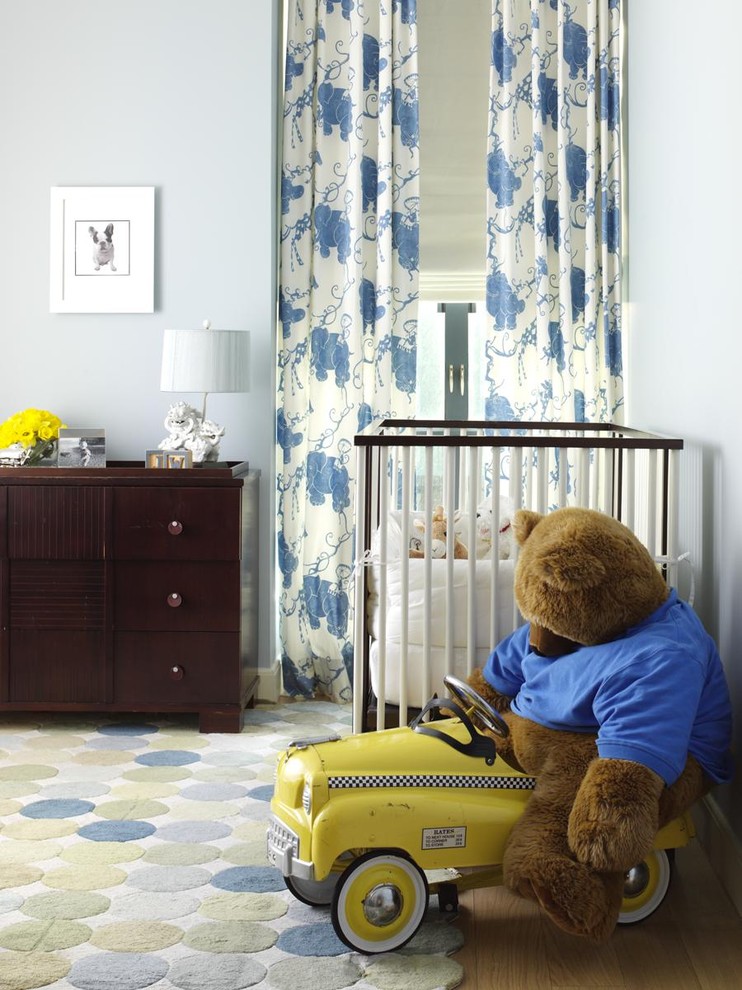 Inspiration for a traditional gender-neutral nursery in New York with blue walls.