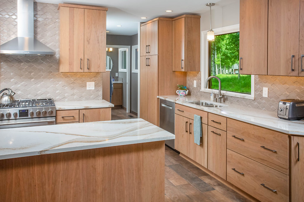 Eat-in kitchen - mid-sized transitional galley eat-in kitchen idea with flat-panel cabinets, medium tone wood cabinets, quartz countertops and stainless steel appliances