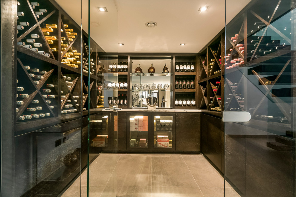 Mid-sized contemporary wine cellar in Other with porcelain floors, diamond bins and grey floor.