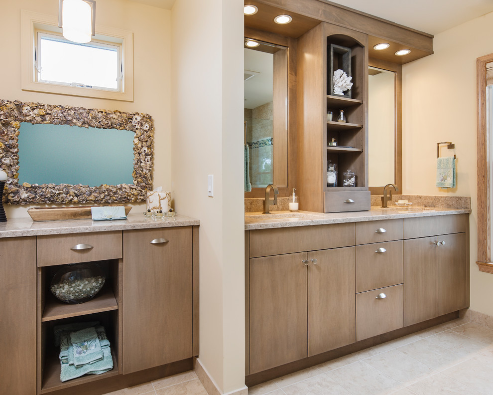 Design ideas for a mid-sized beach style master bathroom in New York with flat-panel cabinets, engineered quartz benchtops, light wood cabinets, beige walls, travertine floors and an undermount sink.