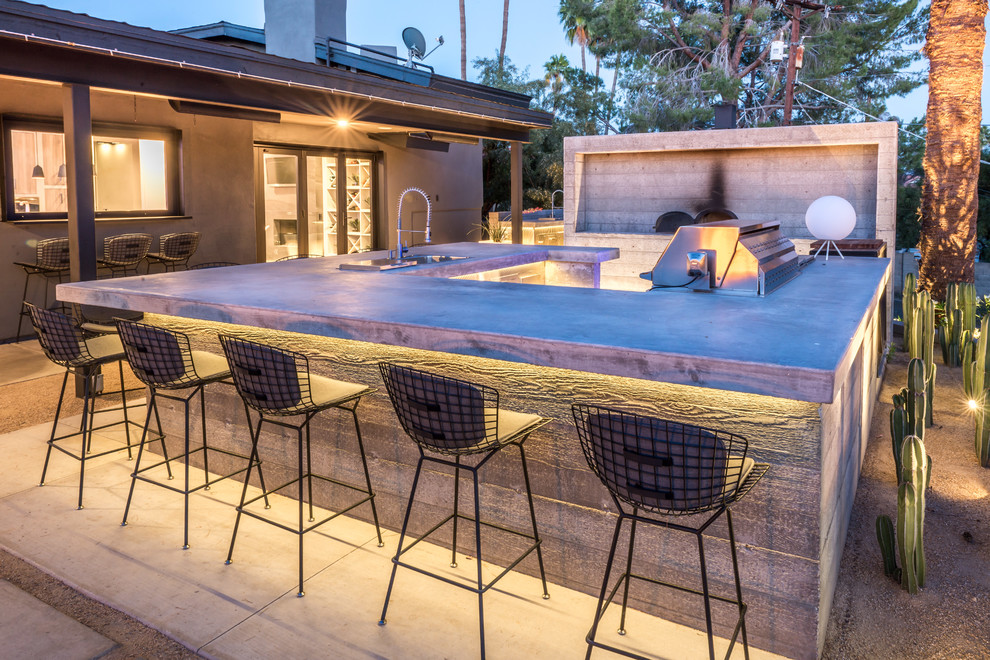 Example of a huge transitional backyard concrete patio kitchen design in Phoenix with no cover