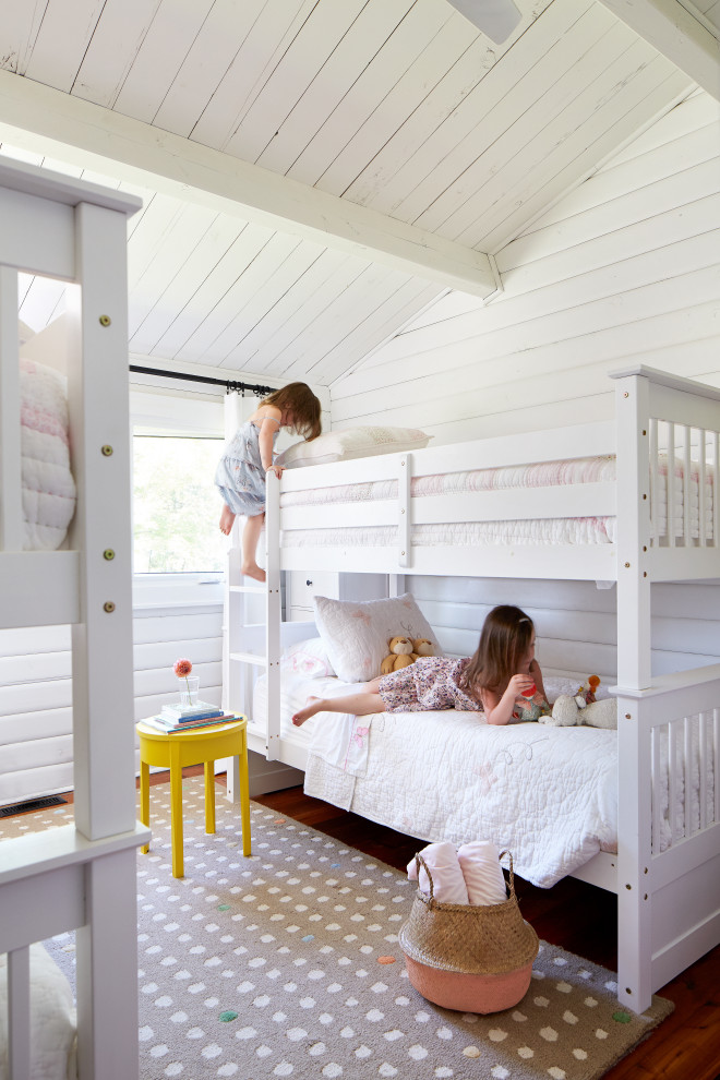 Kids' room - mid-sized cottage medium tone wood floor kids' room idea in Toronto with white walls
