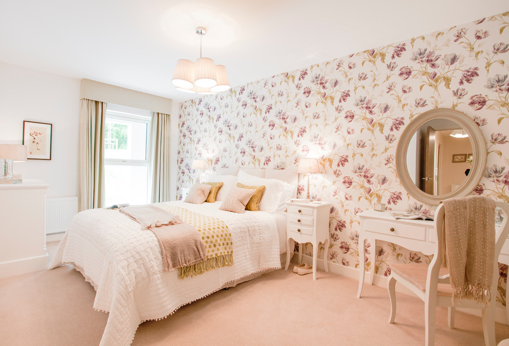 Photo of a mid-sized traditional bedroom in Hampshire with multi-coloured walls, carpet, no fireplace and pink floor.