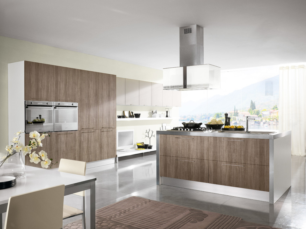 Mid-sized minimalist single-wall ceramic tile eat-in kitchen photo in San Diego with a double-bowl sink, flat-panel cabinets, medium tone wood cabinets, stainless steel countertops, white backsplash, ceramic backsplash, paneled appliances and an island