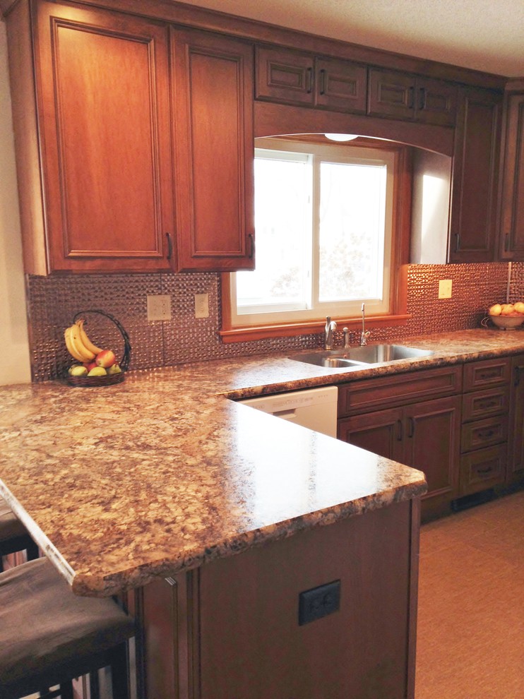 Inspiration for a small transitional u-shaped eat-in kitchen remodel with an undermount sink, flat-panel cabinets, medium tone wood cabinets, laminate countertops and a peninsula