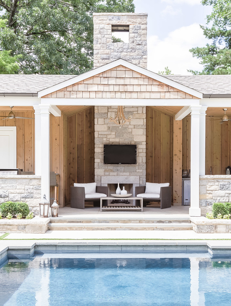 Example of a large transitional backyard natural pool house design