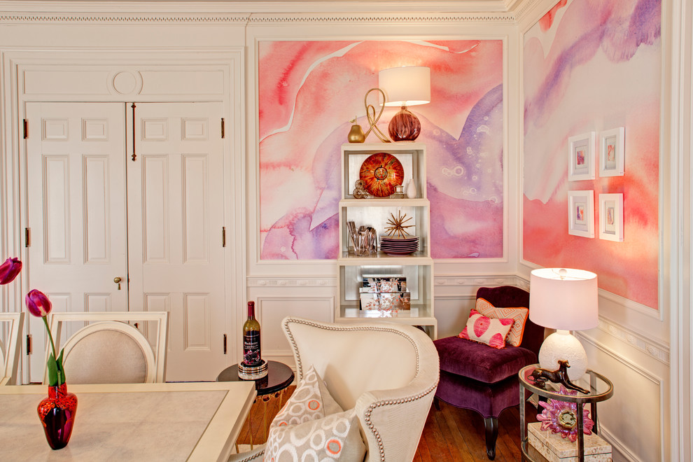 Photo of a transitional separate dining room in Baltimore with pink walls, medium hardwood floors and no fireplace.