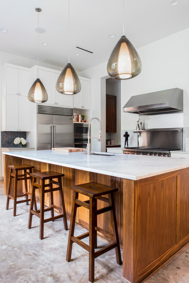 Transitional kitchen photo in Austin with an undermount sink and white cabinets