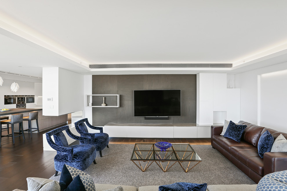 Inspiration for an expansive contemporary formal open concept living room in Sydney with white walls, dark hardwood floors, a two-sided fireplace, a plaster fireplace surround and a built-in media wall.