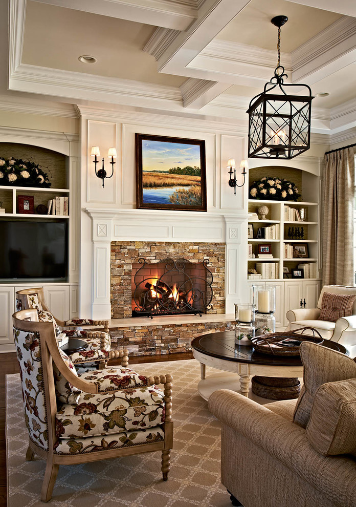 Design ideas for a traditional formal living room in Charlotte with beige walls, a standard fireplace, a stone fireplace surround and a freestanding tv.