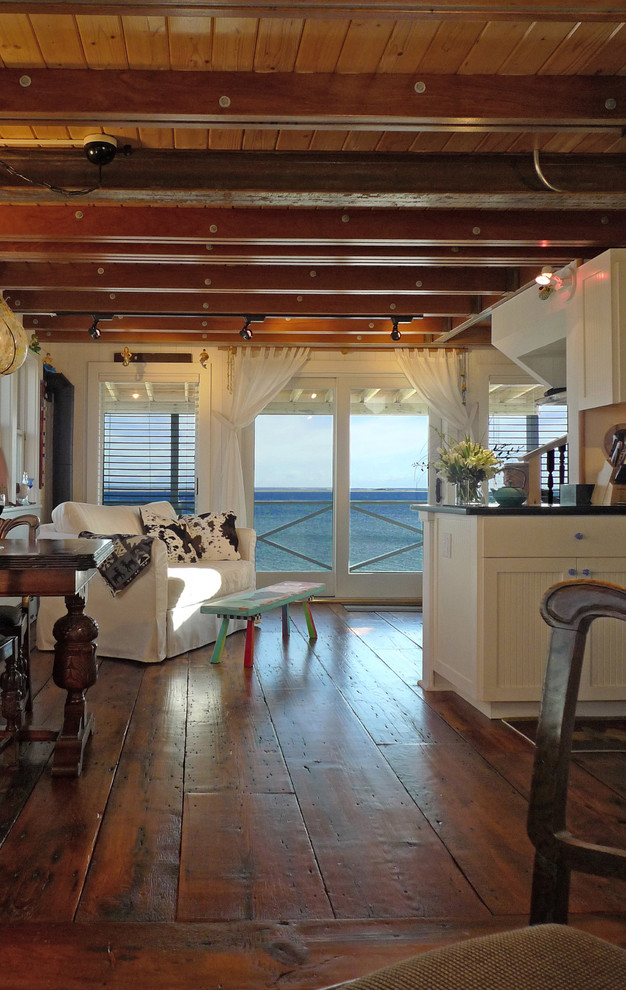 Open concept kitchen - mid-sized transitional l-shaped dark wood floor and brown floor open concept kitchen idea in Boston with louvered cabinets, white cabinets and granite countertops