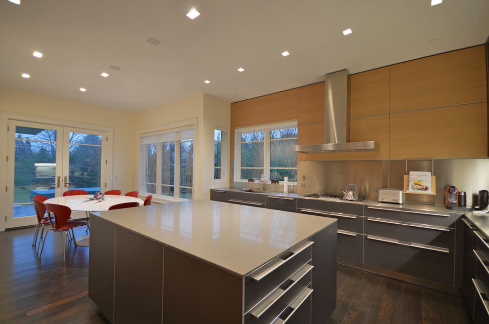 This is an example of a contemporary kitchen in New York with stainless steel appliances.