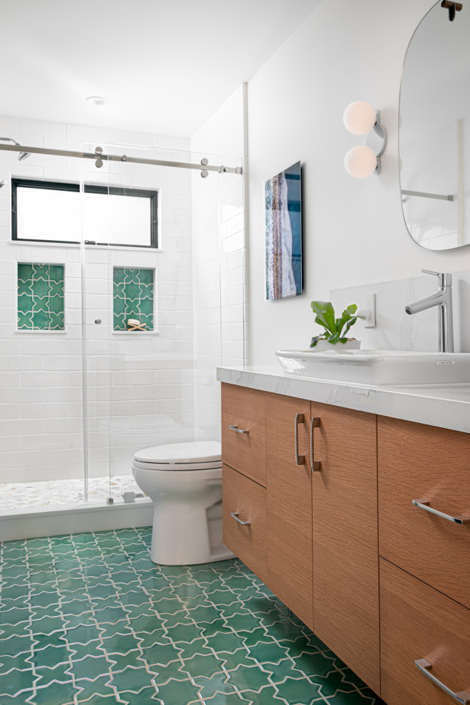 Bathroom - mid-sized mid-century modern kids' white tile and ceramic tile ceramic tile, green floor and single-sink bathroom idea in Other with flat-panel cabinets, medium tone wood cabinets, a one-piece toilet, white walls, a vessel sink, quartz countertops, white countertops, a niche and a floating vanity