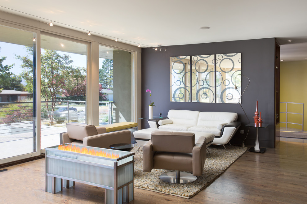 Inspiration for a mid-sized 1950s formal and open concept dark wood floor and brown floor living room remodel in Salt Lake City with black walls and no tv