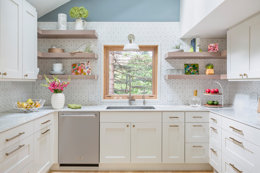 Design ideas for a mid-sized scandinavian u-shaped kitchen in Minneapolis with a double-bowl sink, flat-panel cabinets, white cabinets, white splashback, ceramic splashback, stainless steel appliances, light hardwood floors, no island, yellow floor and white benchtop.
