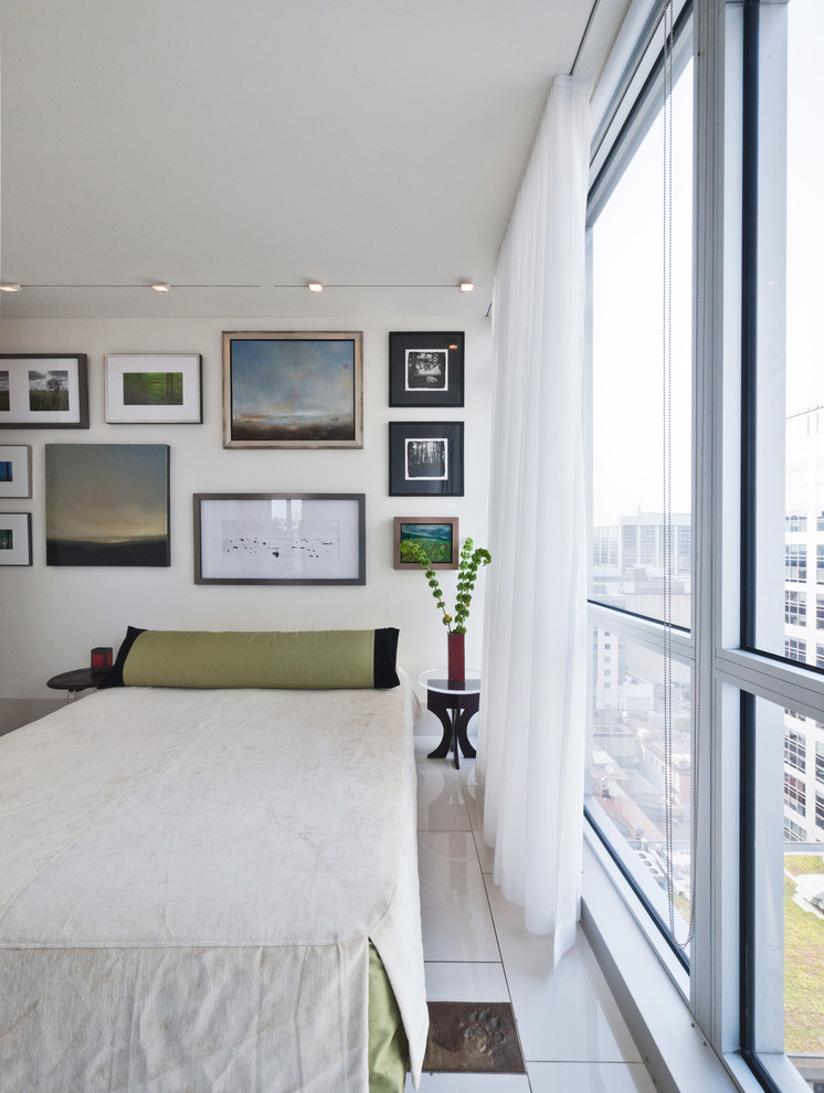 This is an example of a contemporary bedroom in Ottawa with white walls and white floor.